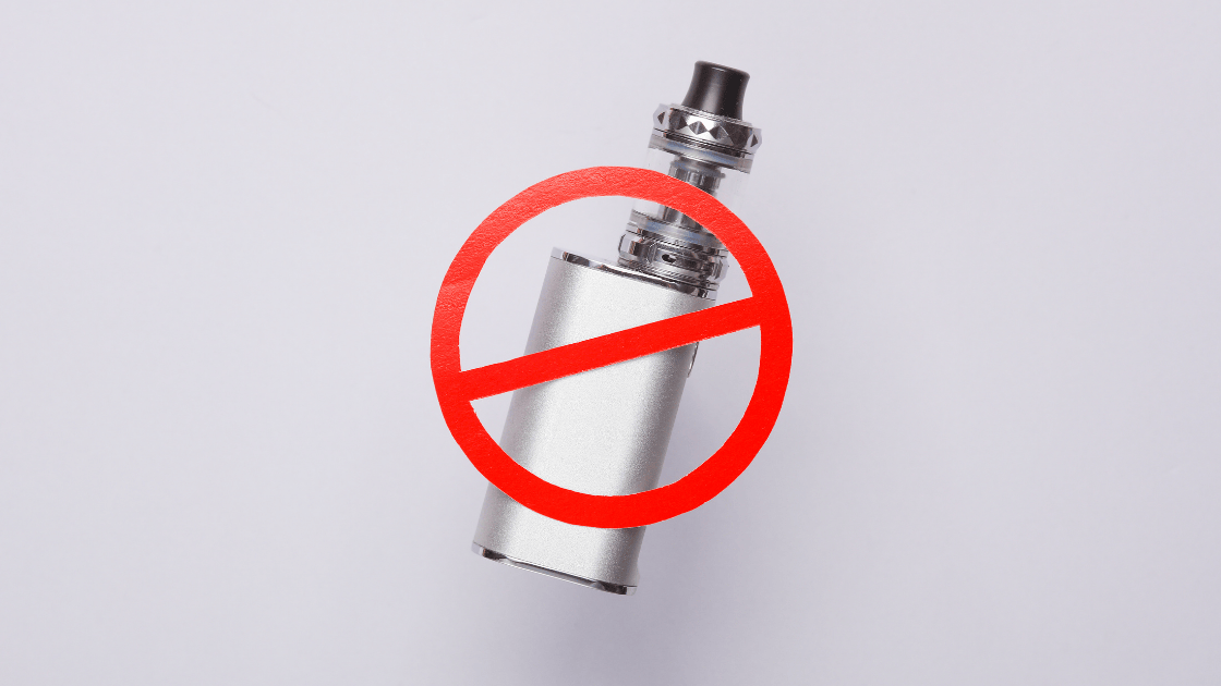 A vape device crossed out with a banned signage, emphasizing the dangers of vaping-associated lung disease and the importance of health screenings in Singapore.