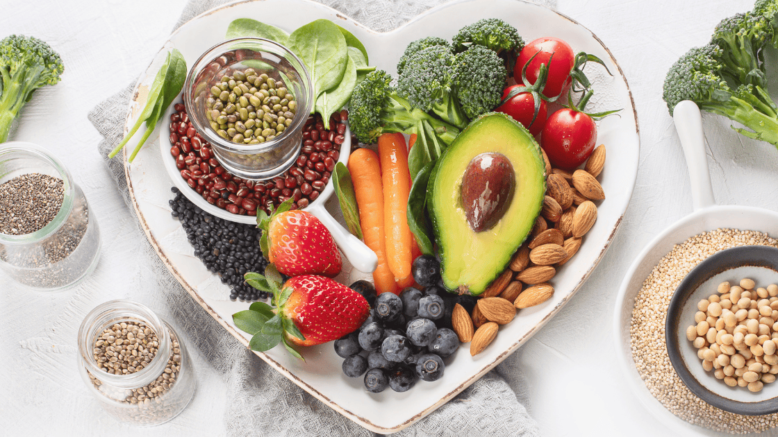 A plate filled with fresh vegetables, promoting longevity and health screening SG.
