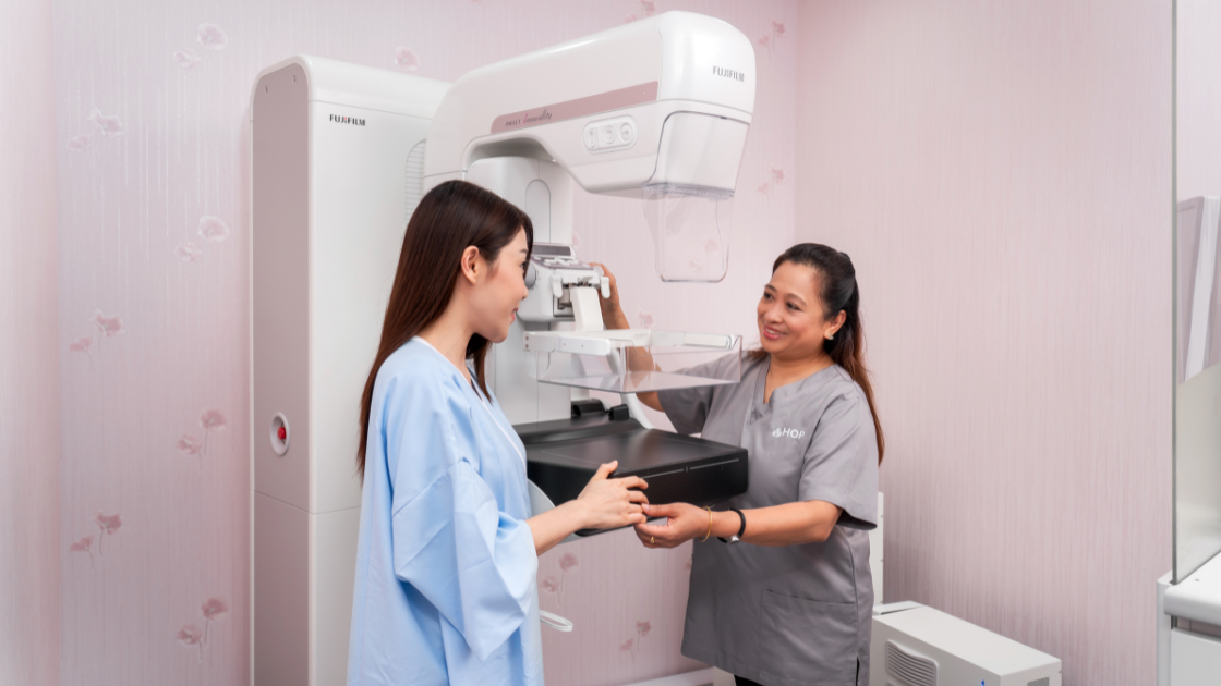 HOP nurse assisting a patient during a mammogram procedure at HOP Medical Centre – health screening SG