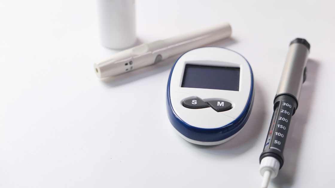 Close-up of an insulin meter checking blood sugar levels for health screening SG