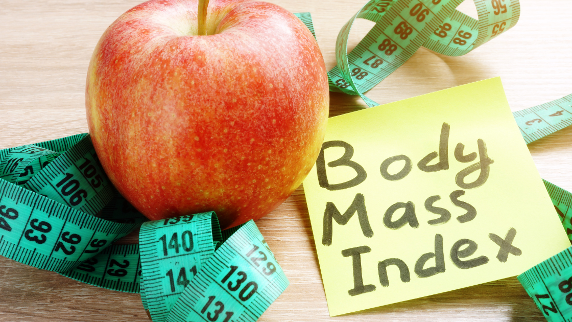 Apple with measuring tape and sticky note labeled Body Mass Index, representing BMI health screening in Singapore