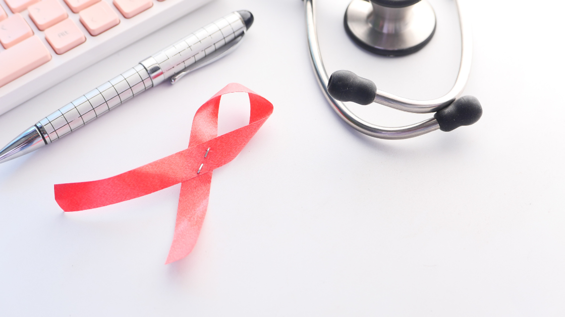 Pink ribbon symbol with doctor’s stethoscope representing ovarian cancer awareness and early detection through health screening in Singapore.