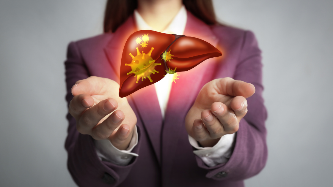 Professional woman in medical setting holding animated liver graphic illustration, demonstrating liver health concepts at HOP Medical Centre Singapore