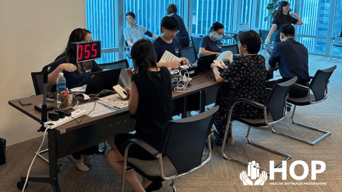 Health Outreach Programme HOP SG corporate health screening event with employees participating in workplace wellness program