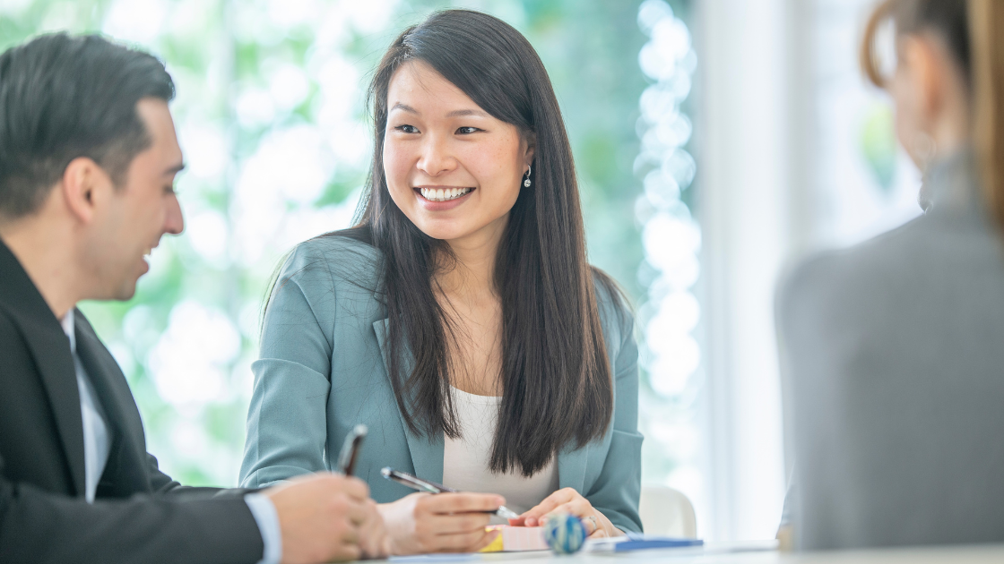Executives in premium Singapore business meeting, representing the hidden health epidemic among successful corporate leaders who need executive health screening