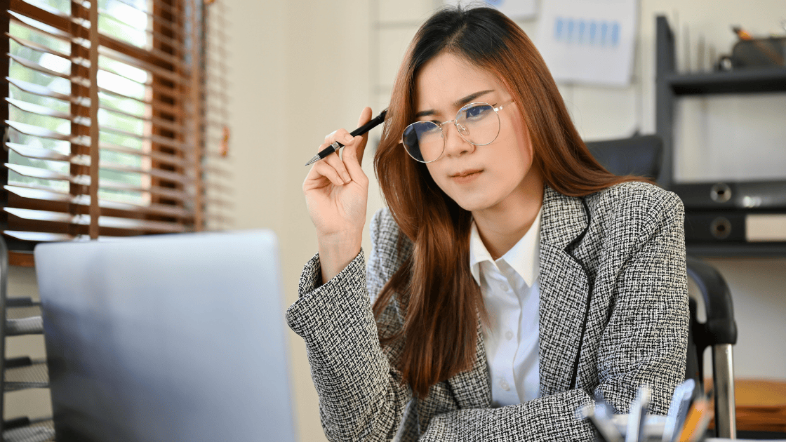 Professional female CEO reviewing corporate health screening Singapore reports for executive wellness program implementation