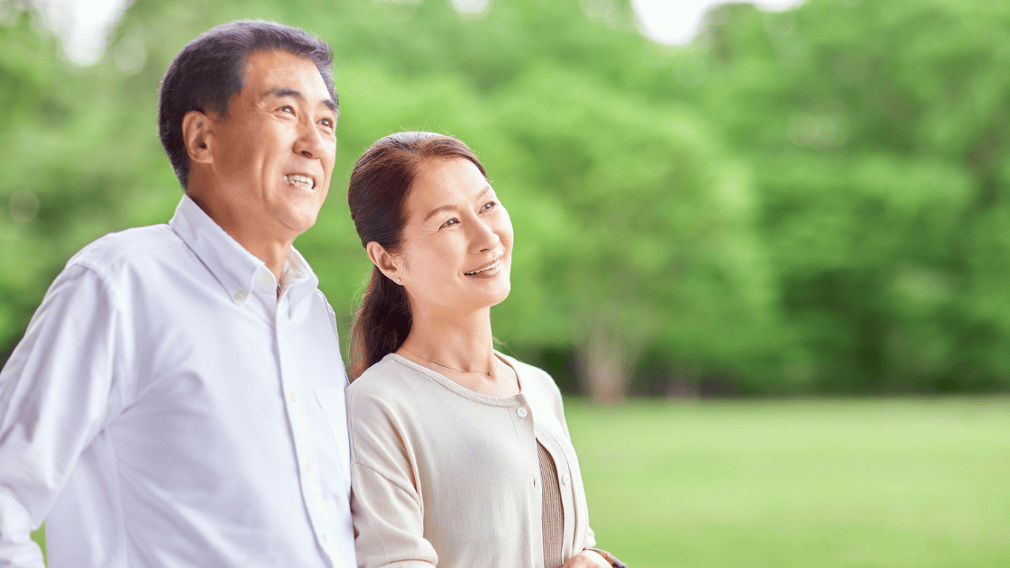 Happy Singaporean couple in their 50s promoting hypertension screening Singapore awareness