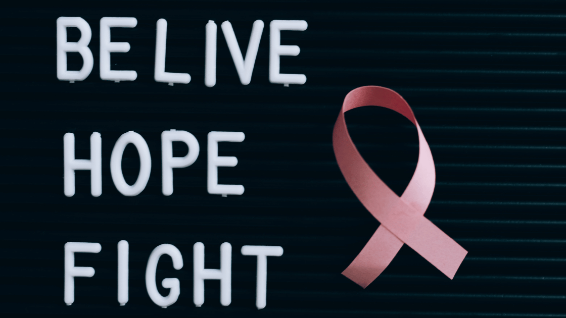 Pink ribbon with believe hope fight words symbolizing life after breast cancer Singapore survivors