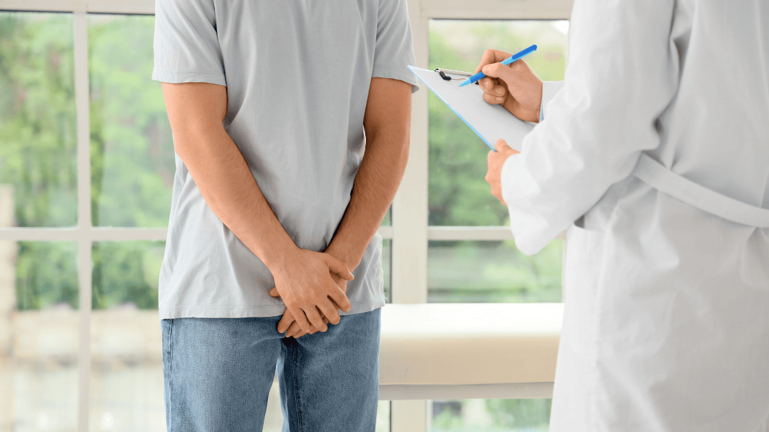 Male patient receiving prostate health screening with medical professional, demonstrating comprehensive prostate assessment and early detection care