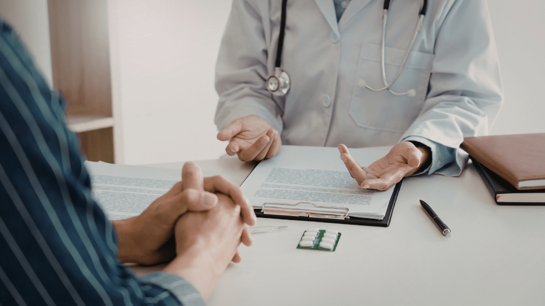 Doctor reviewing health screening package costs with a patient at HOP Medical Centre Singapore