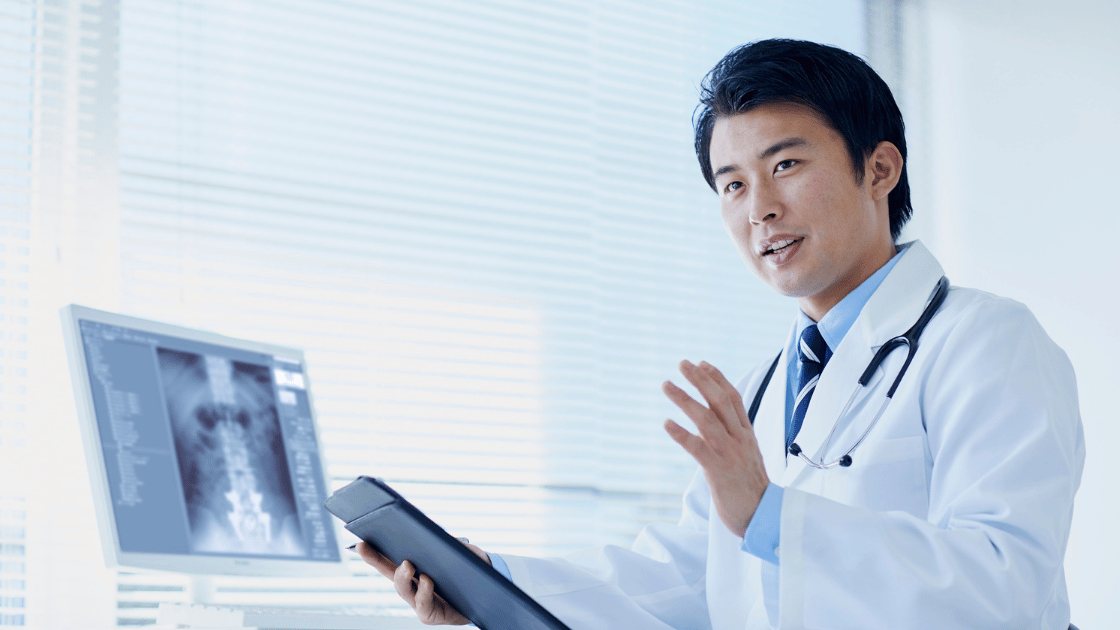 Male patient discussing men's health screening options with a doctor at HOP Medical Centre Singapore